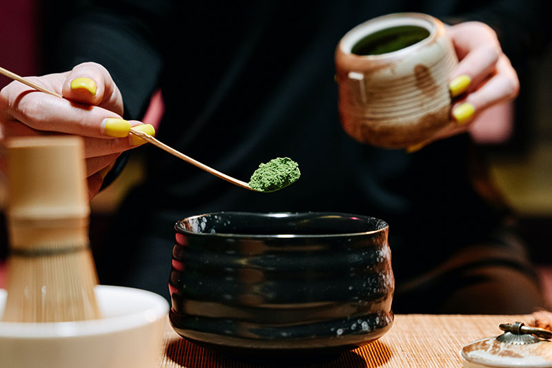 preparing matcha tea